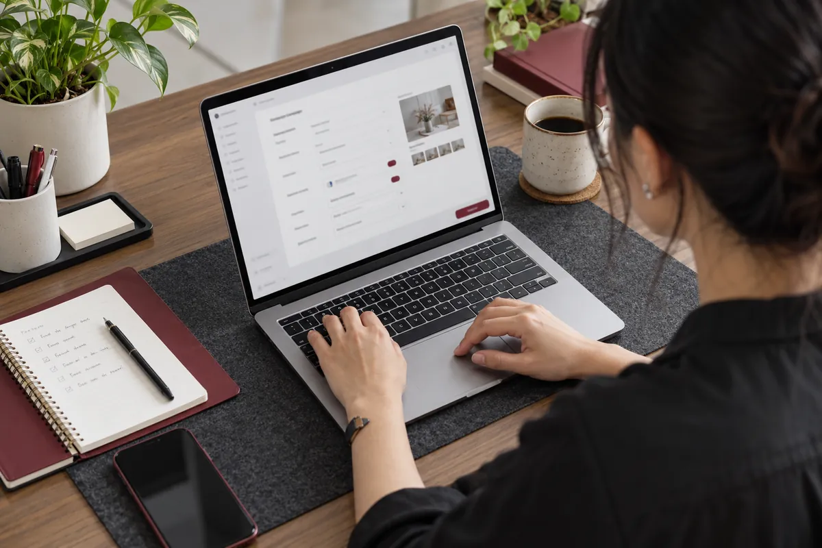 Illustrative marketer setting up an advertising campaign on a laptop